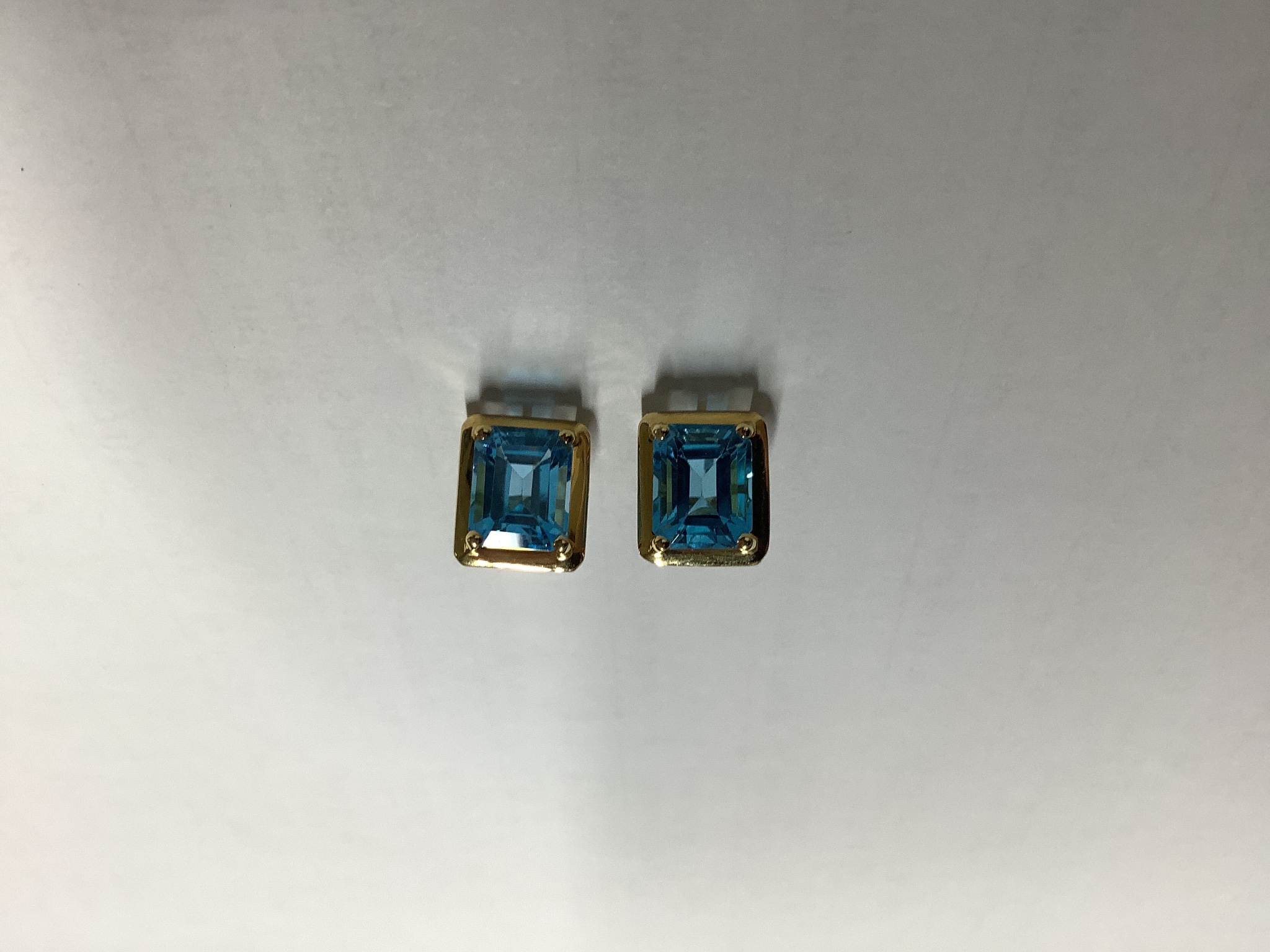 A pair of 18ct gold and topaz earrings, gross 4g.